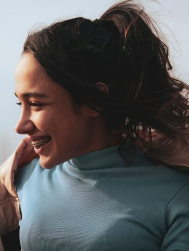 a woman with her hair in the wind
