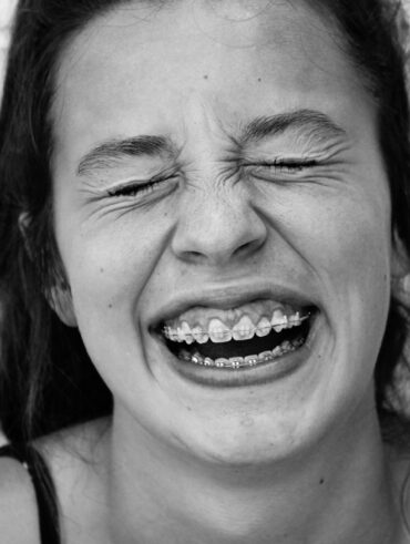 smiling woman in black tank top