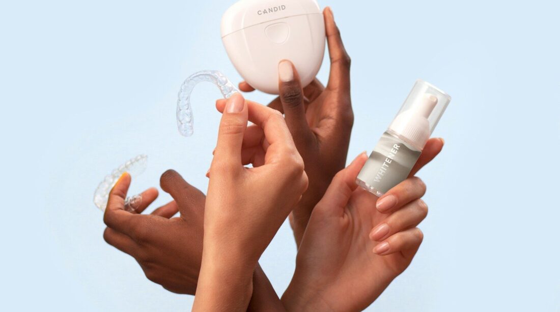 a group of people holding a white object in their hands