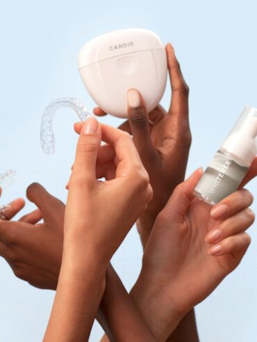 a group of people holding a white object in their hands